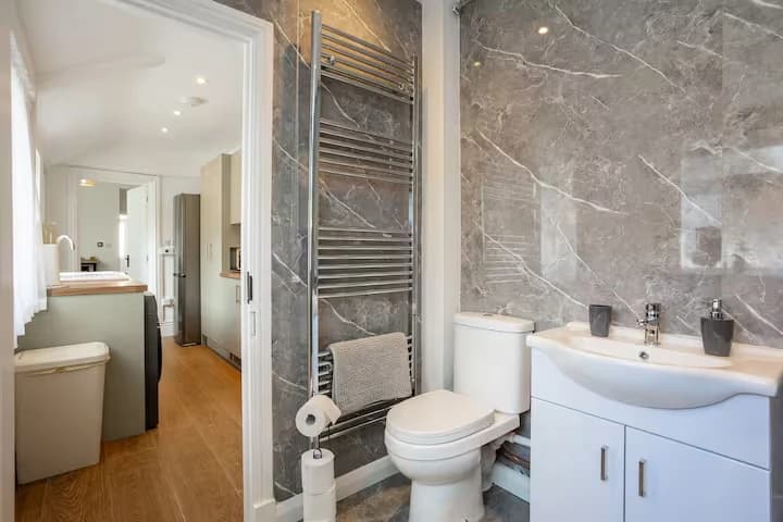 Bathroom with basin and heated towel rail at Algernon Road, Melton Mowbray