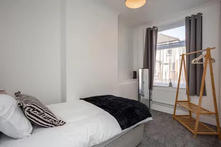 Bedroom with bed and clothes rail at Algernon Road, Melton Mowbray