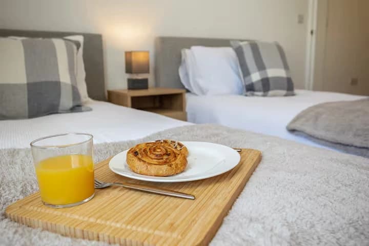 Twin beds with a breakfast tray at Algernon Road, Melton Mowbray
