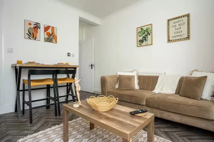 Lounge with sofa and bar seating at Algernon Road, Melton Mowbray