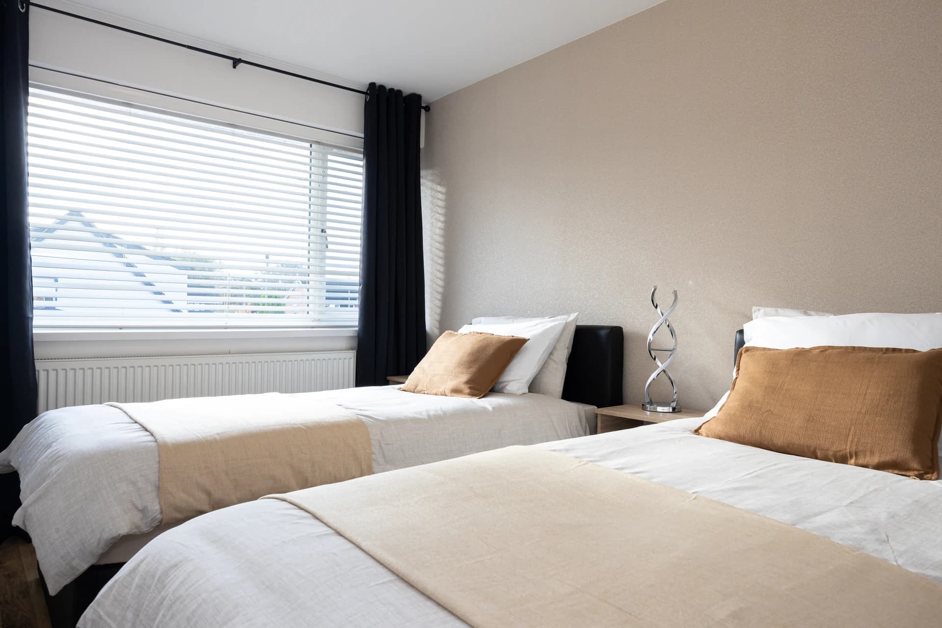 Twin bedroom with two beds and fresh linen at Amberwood Drive, Wythenshawe