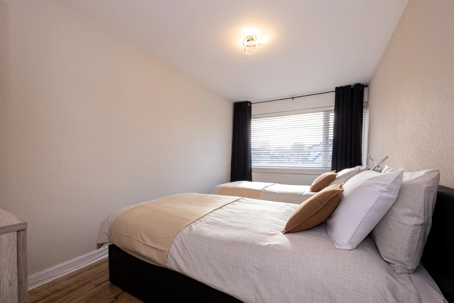 Bedroom with fresh linen and window at Amberwood Drive, Wythenshawe