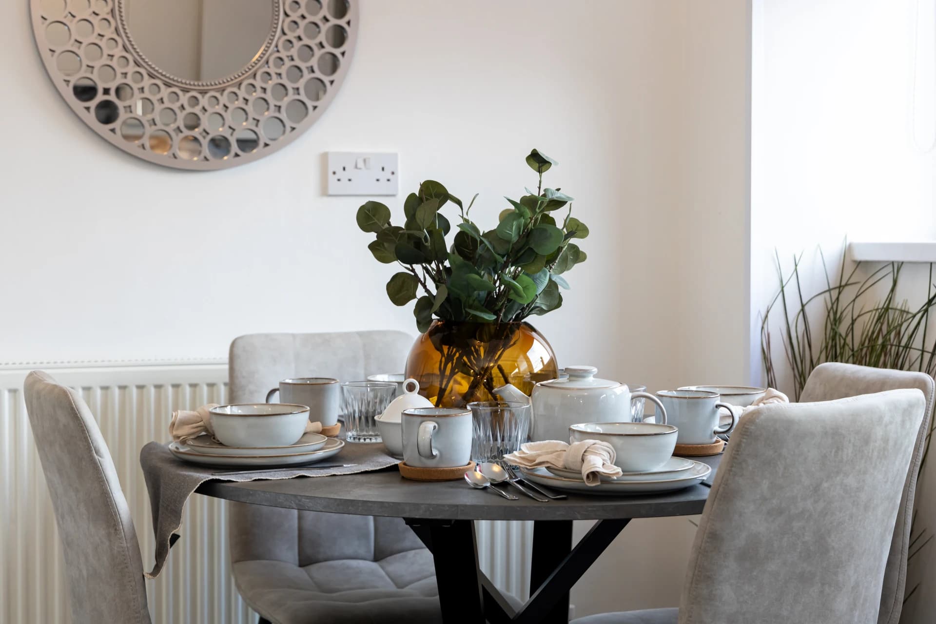 Dining table laid for guests at Amberwood Drive, Wythenshawe