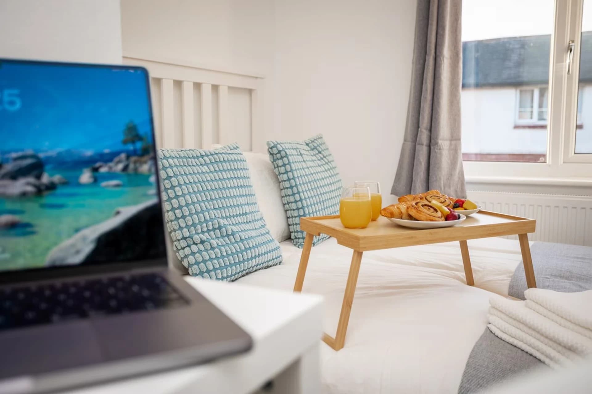 Breakfast tray on the double bed in the main bedroom at Doctor's Lane
