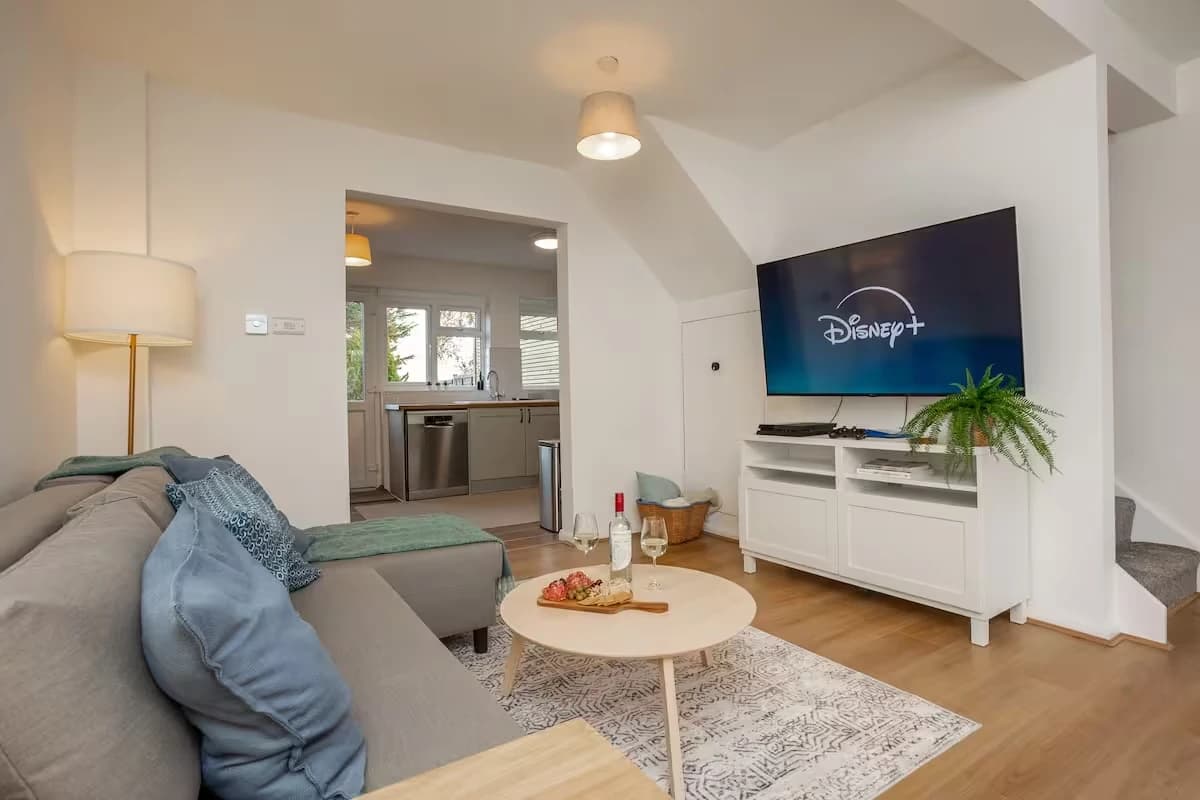 Living room with sofa, coffee table and TV at Doctor's Lane, Melton Mowbray