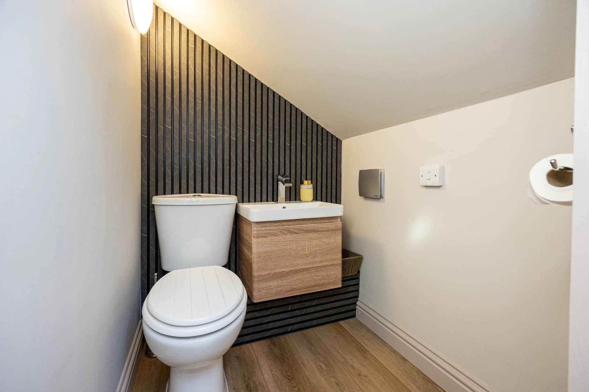 Downstairs WC with feature wall at Meadow Croft, Wythenshawe