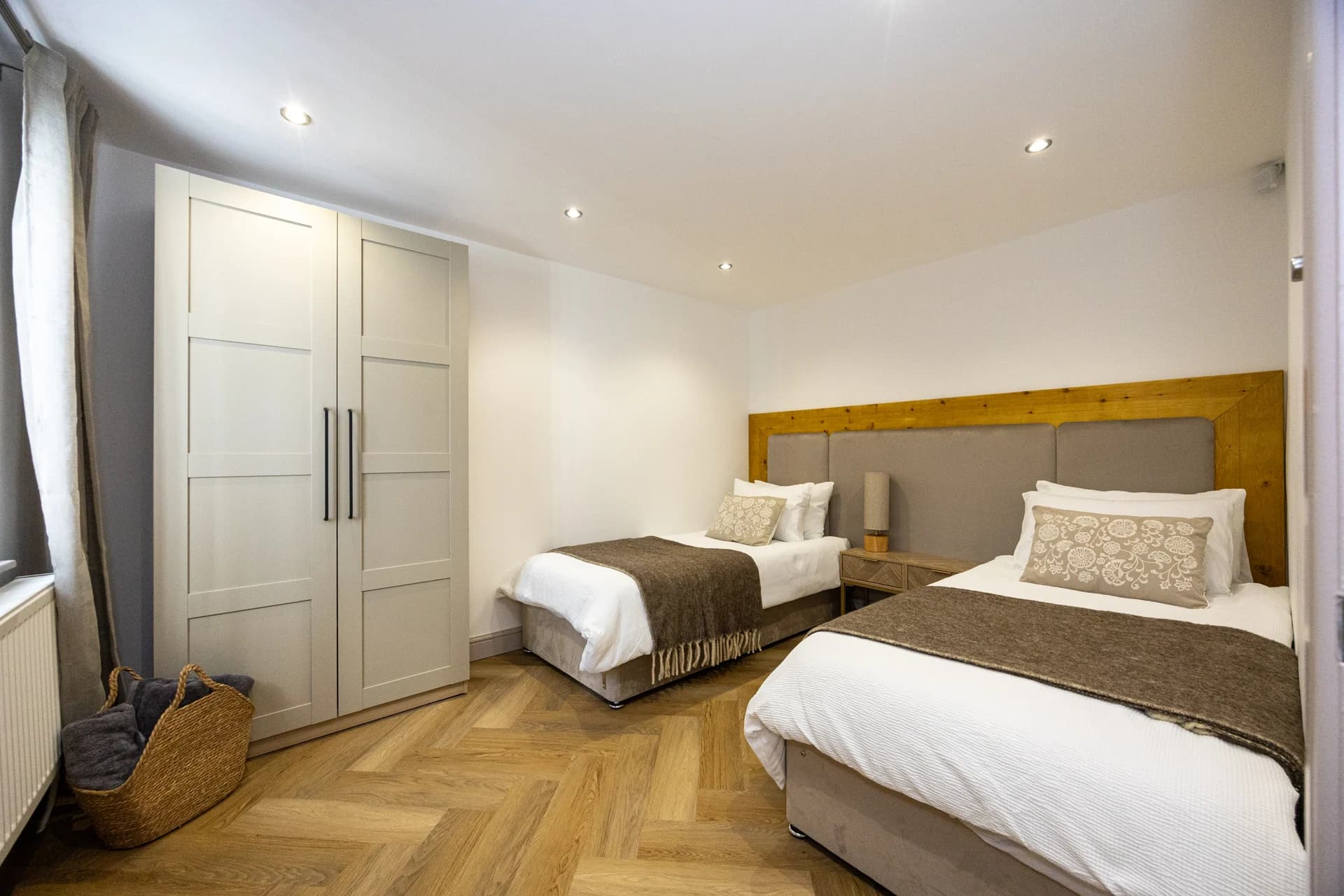 Bedroom with double and single beds at Meadow Croft, Wythenshawe