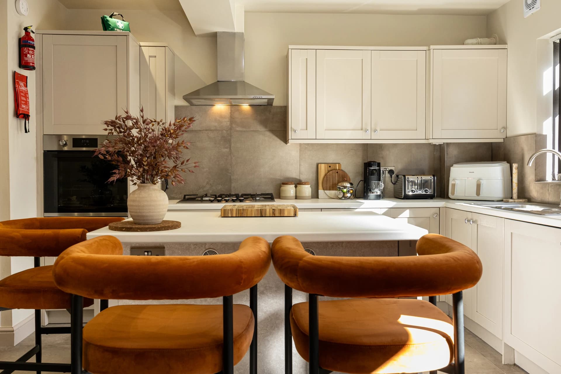 Kitchen with breakfast bar and stools at Meadow Croft, Wythenshawe