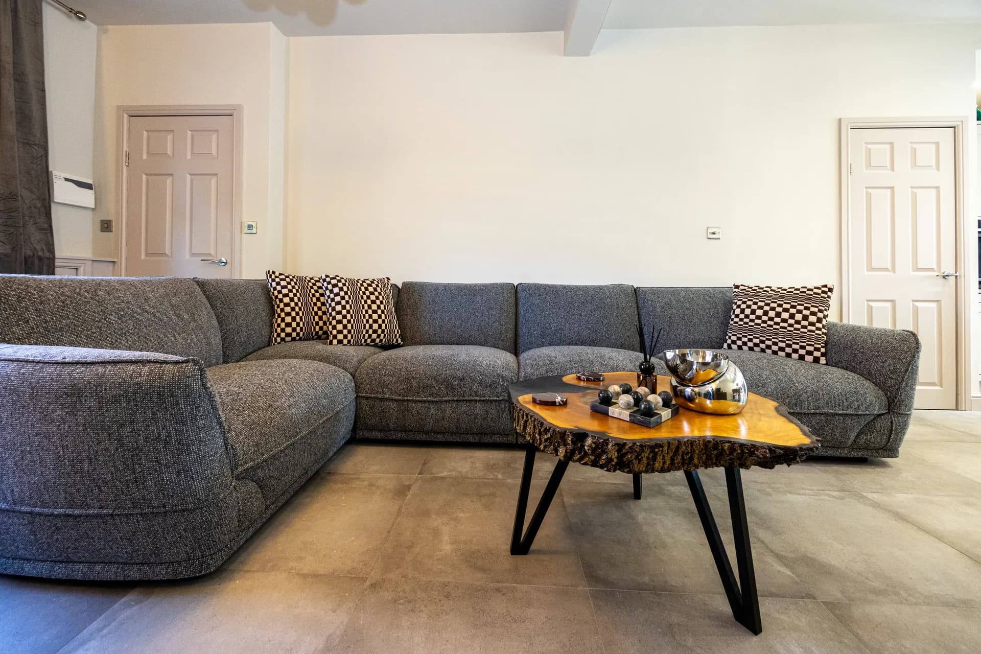 Large corner sofa and coffee table in the lounge at Meadow Croft, Wythenshawe